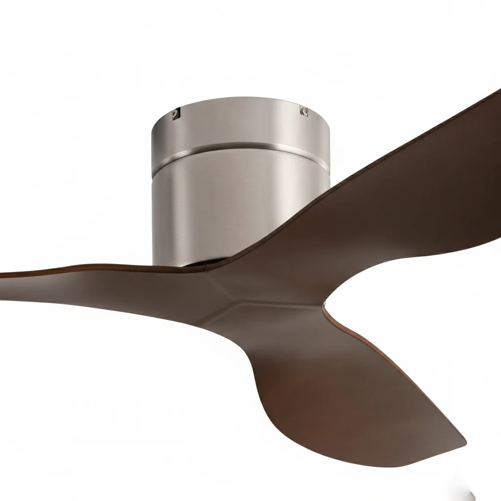 Close-up of the brushed silver housing where the dark walnut blades meet
