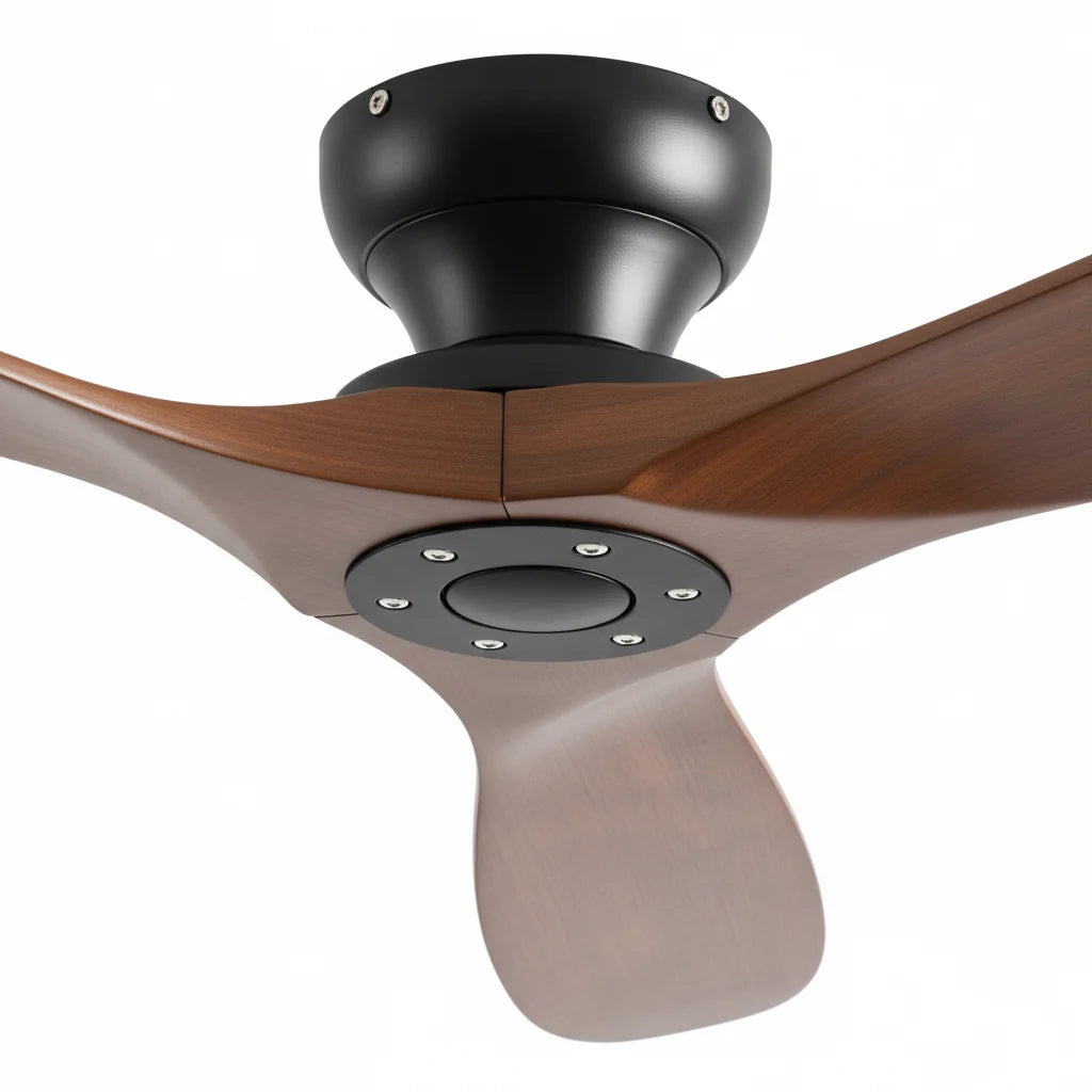 The black motor housing where the three walnut blades meet
