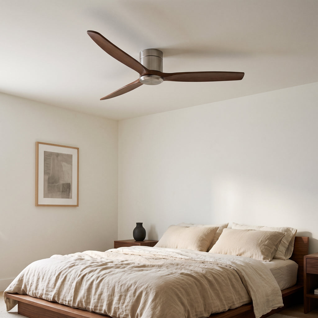 Bozeman ceiling fan in walnut and brushed silver above a bed
