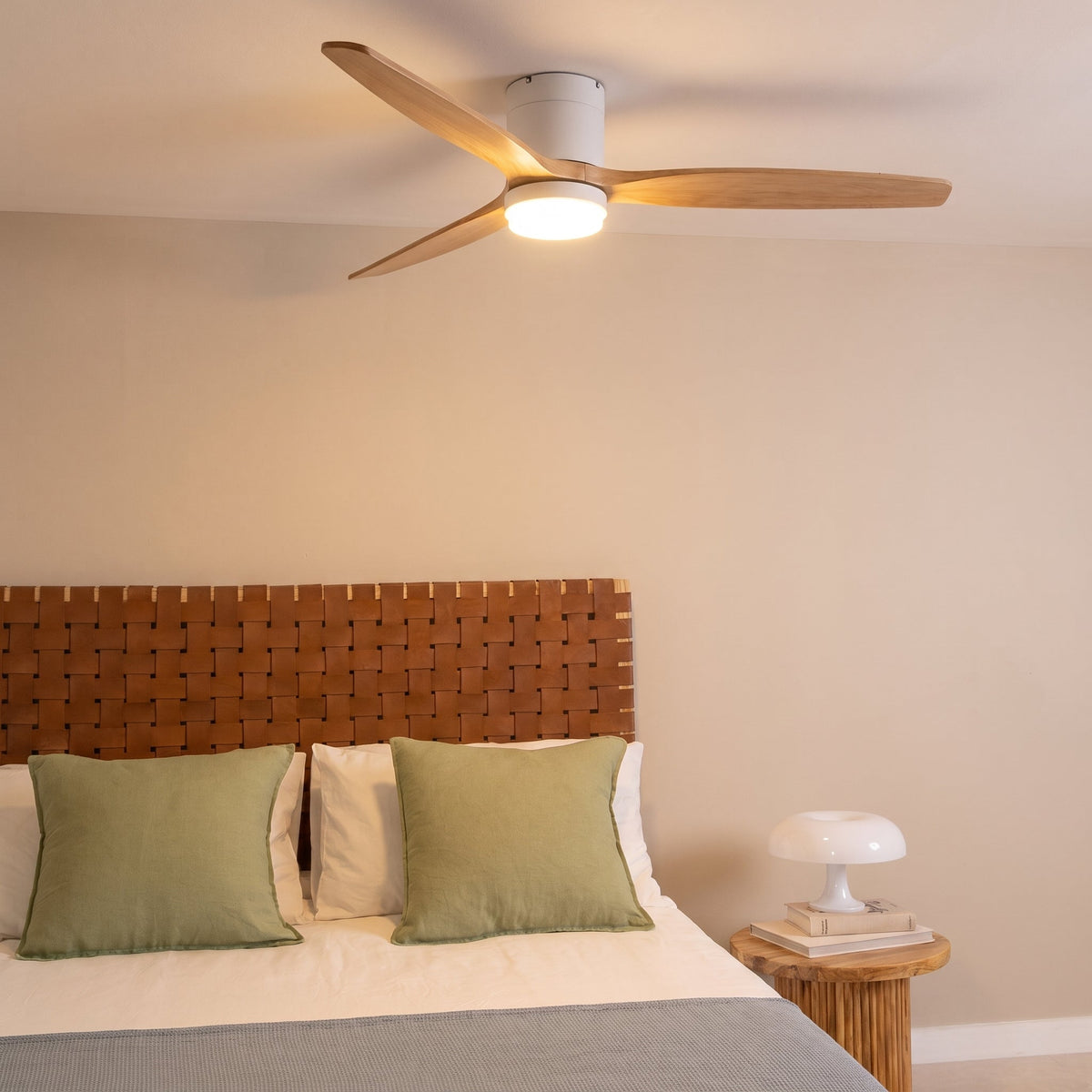 Bozeman ceiling fan with its light on in a bedroom