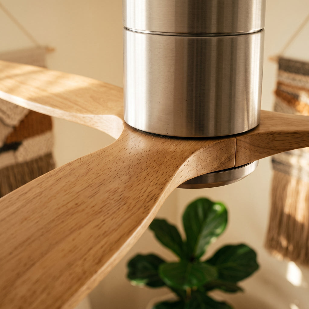 Close-up of the brushed silver housing against an oak blade