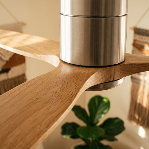Close-up of the brushed silver housing against an oak blade