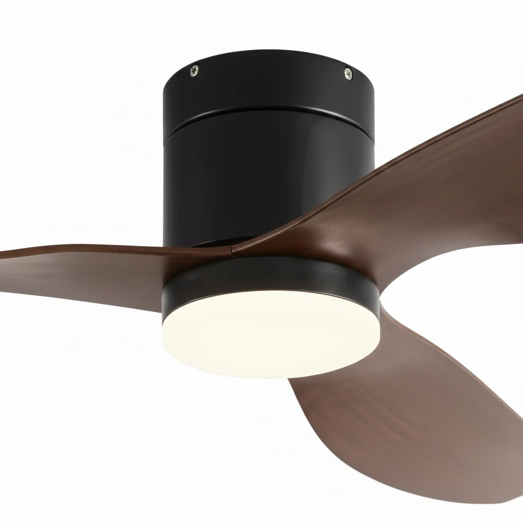 Close-up of the matte black housing where the dark walnut blades meet
